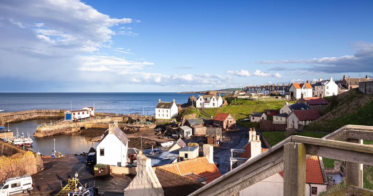 Pretty UK village with colourful cottages and amazing views over the sea
