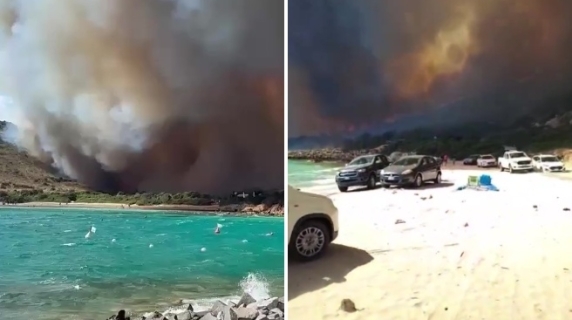 Video van de brand bij het strand: angst onder zwemmers