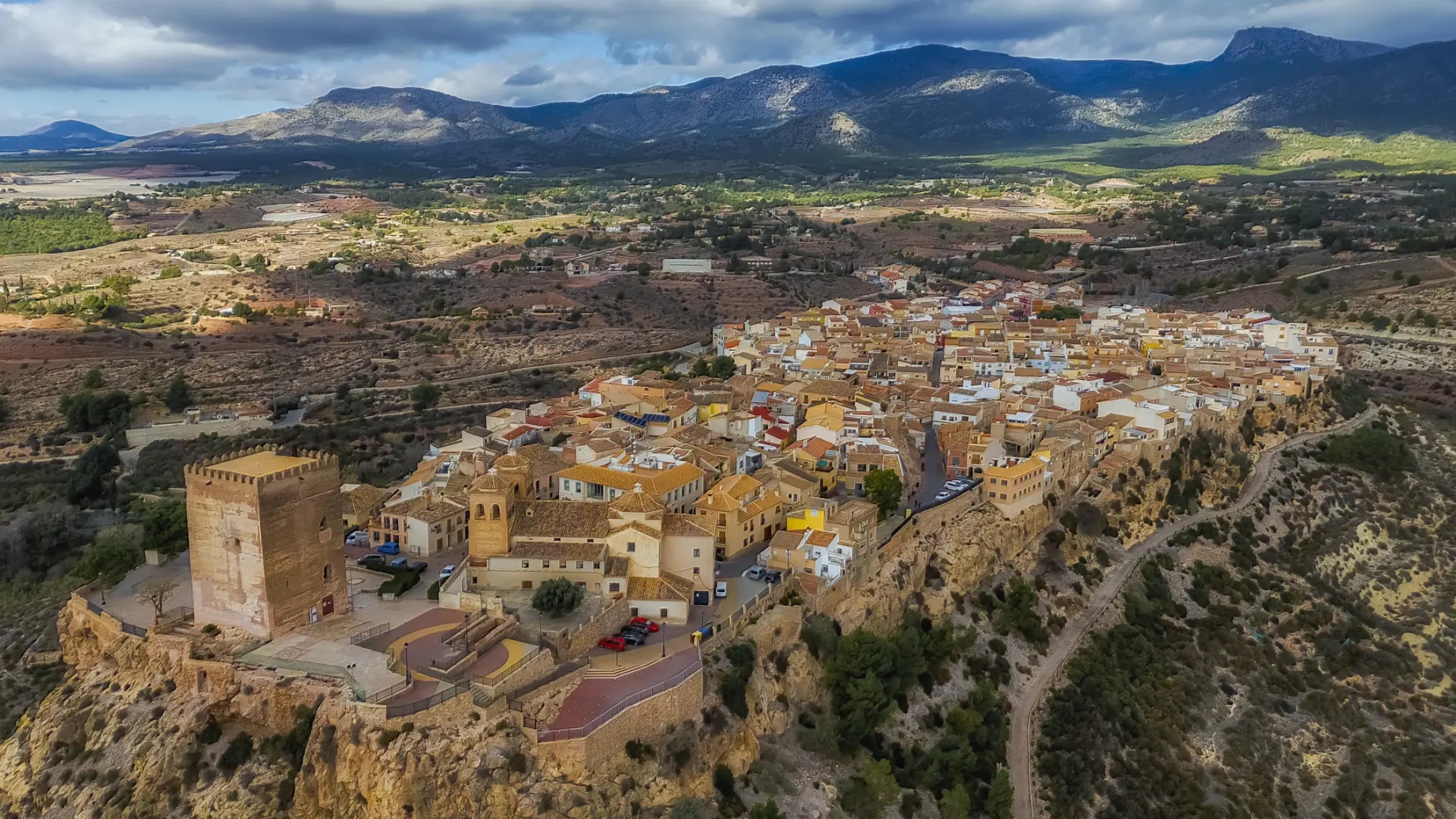 The medieval village of Murcia located on a hill and in the middle of an impressive landscape
