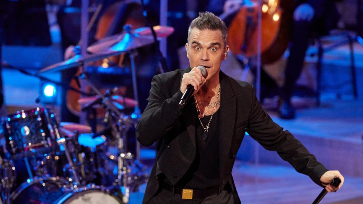 Een Ierse muzikant beweert dat Robbie Williams de auteur is van 'Angels'.