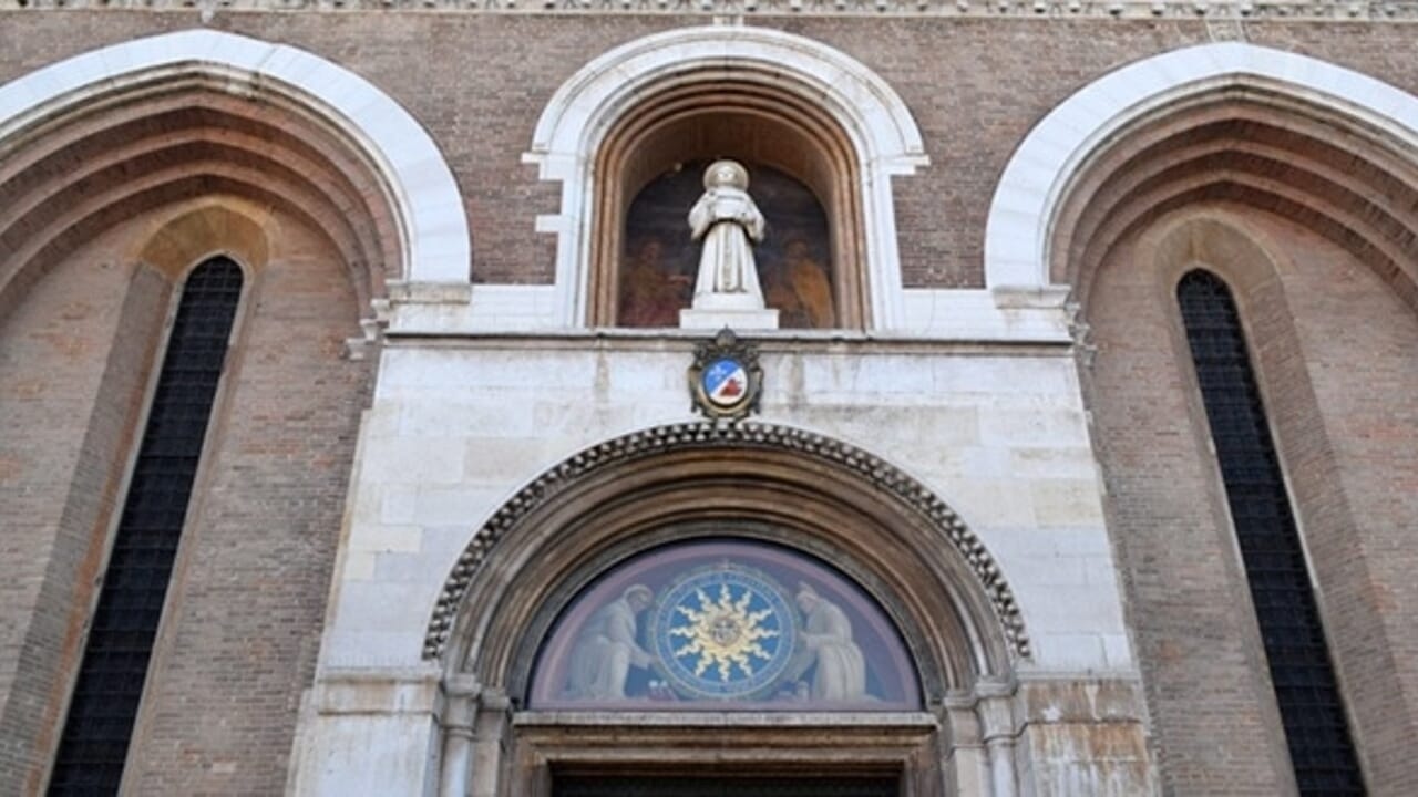 Basilica of St. Anthony, the coat of arms of Pope Leo XIV hoisted on the facade