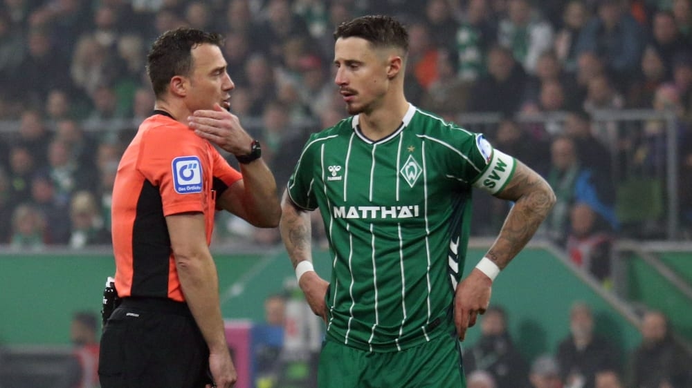 Цвайер поясняет сцену с рукой: «Отличная работа в Кельне!»