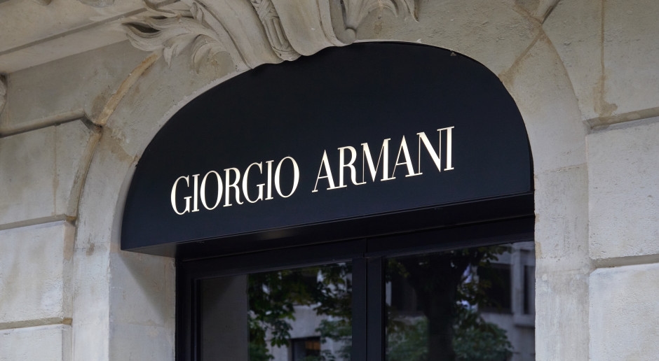 Is Hedi Slimane the new Armani? The luxury fashion world is buzzing with rumors.